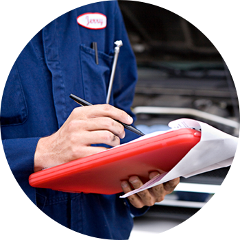Mechanic performing automotive maintenance in State College, PA