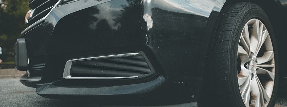 closeup of front of car and left tire before wheel alignment in Rockville, MD