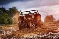 UTV driving through mud